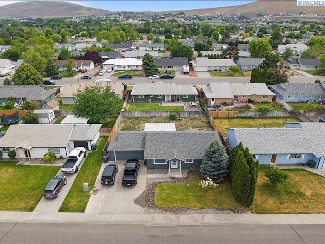 aerial perspective of suburban area featuring a mountainous background