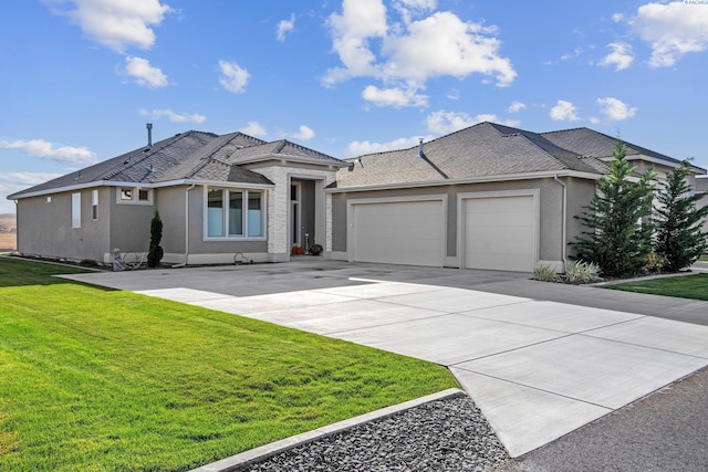 view of front of house featuring a garage and a front yard