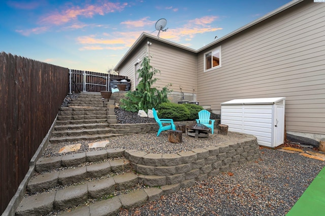 yard at dusk with a fire pit