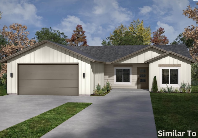 view of front of property with a garage and a front yard