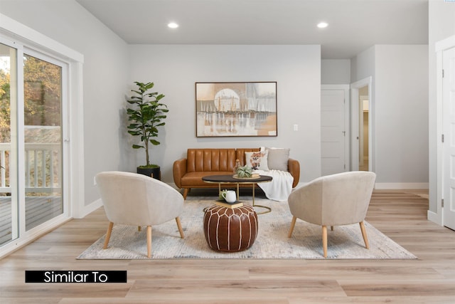 sitting room with light hardwood / wood-style flooring