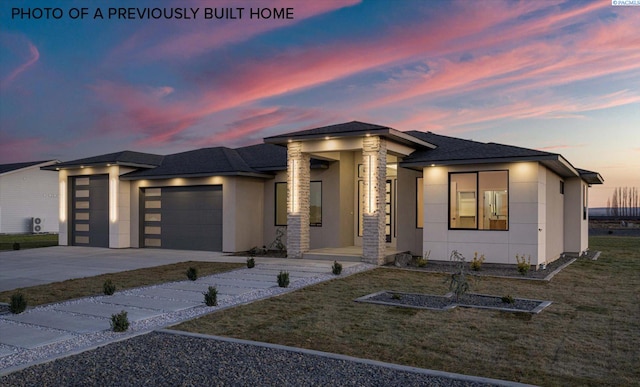 2260 Belfair St Unit 5, Kennewick, WA 99338 - prairie-style house featuring roof with shingles, a front lawn, concrete driveway, an attached garage, and stucco siding