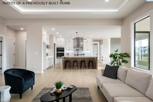 2260 Belfair St Unit 5, Kennewick, WA 99338 - living room with recessed lighting, a raised ceiling, and light wood-style flooring