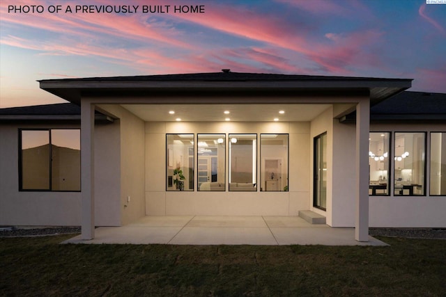 2260 Belfair St Unit 5, Kennewick, WA 99338 - rear view of house with stucco siding, a yard, and a patio area