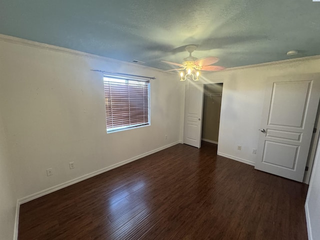 2002 Diamond Head Way, West Richland, WA 99353 - unfurnished bedroom featuring wood finished floors, crown molding, a closet, a ceiling fan, and a textured ceiling