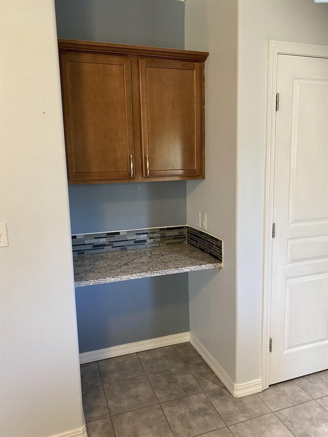 2002 Diamond Head Way, West Richland, WA 99353 - kitchen with tile patterned flooring, brown cabinets, and stone counters