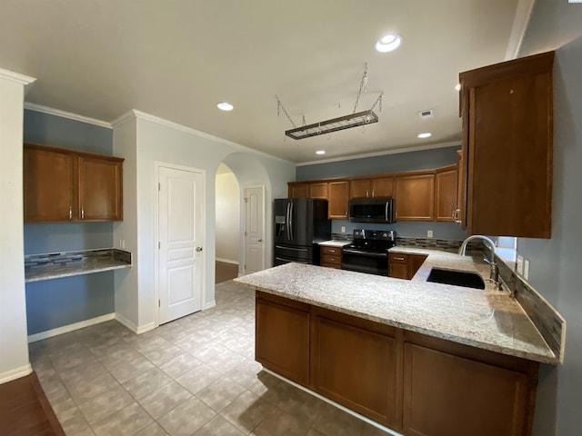 2002 Diamond Head Way, West Richland, WA 99353 - kitchen featuring black appliances, a peninsula, crown molding, arched walkways, and light stone counters