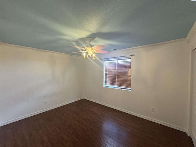 2002 Diamond Head Way, West Richland, WA 99353 - spare room with dark wood-style floors, ceiling fan, a textured ceiling, and crown molding