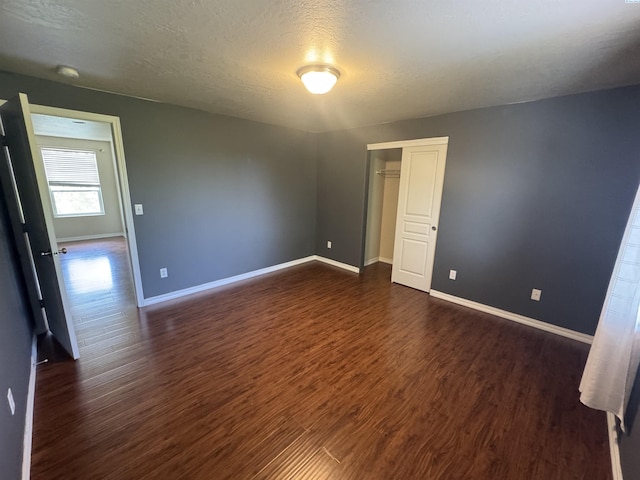 2002 Diamond Head Way, West Richland, WA 99353 - spare room featuring dark wood-style floors and a textured ceiling