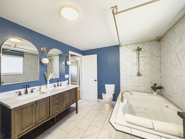 full bath with toilet, a sink, a whirlpool tub, and double vanity