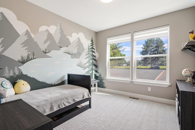 bedroom featuring carpet, visible vents, and baseboards