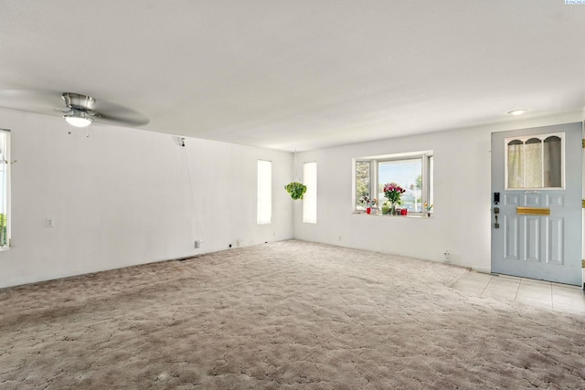 616 S Conway St, Kennewick, WA 99336 - unfurnished living room featuring carpet flooring and a ceiling fan