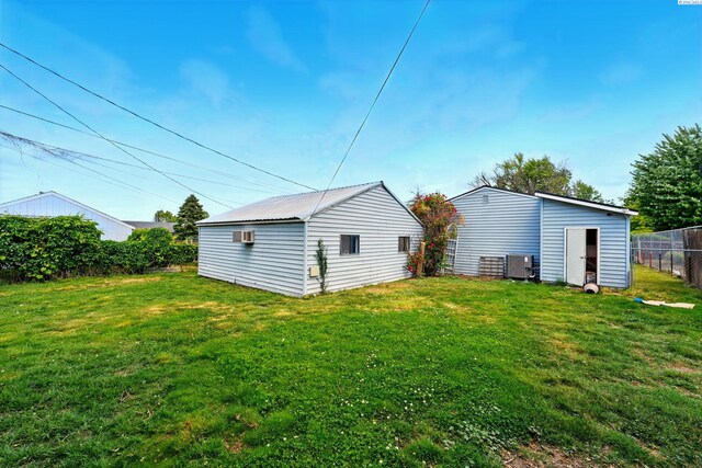 616 S Conway St, Kennewick, WA 99336 - rear view of house with an outbuilding and central AC unit