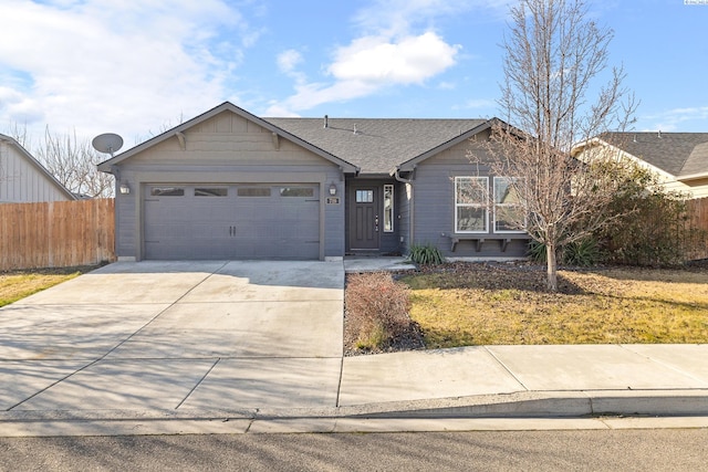 ranch-style house featuring concrete driveway, roof with shingles, fence, and an attached garage