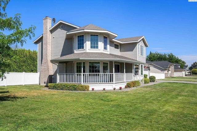 10219 W Argent Rd, Pasco, WA 99301 - view of front of house featuring a porch, a chimney, and roof with shingles