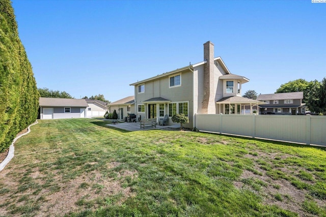 10219 W Argent Rd, Pasco, WA 99301 - back of house with a patio and a chimney