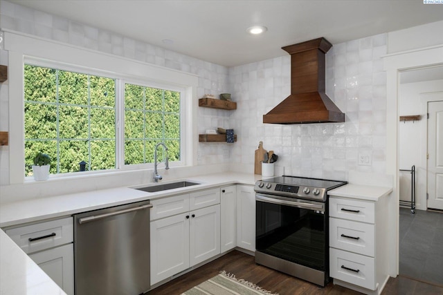 10219 W Argent Rd, Pasco, WA 99301 - kitchen featuring stainless steel appliances, wall chimney exhaust hood, light countertops, healthy amount of natural light, and recessed lighting
