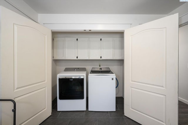 10219 W Argent Rd, Pasco, WA 99301 - washroom featuring separate washer and dryer, cabinet space, and dark tile patterned flooring