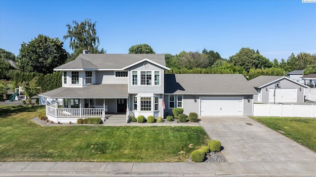 10219 W Argent Rd, Pasco, WA 99301 - view of front of home with covered porch, concrete driveway, a garage, and roof with shingles