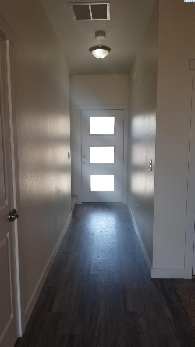 doorway to outside with dark hardwood / wood-style flooring