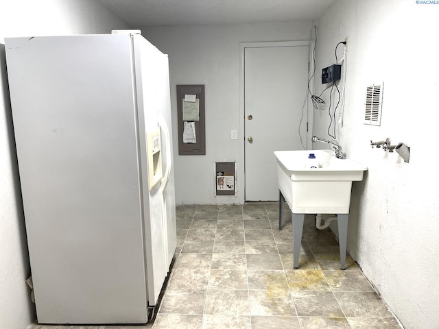 interior space featuring stone finish flooring and visible vents