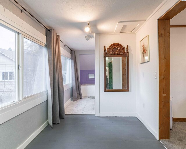 807 S Mill St, Colfax, WA 99111 - hallway featuring baseboards and wood finished floors
