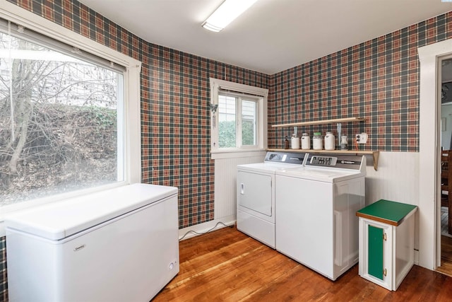 807 S Mill St, Colfax, WA 99111 - laundry area featuring wallpapered walls, washer and dryer, and light wood-type flooring