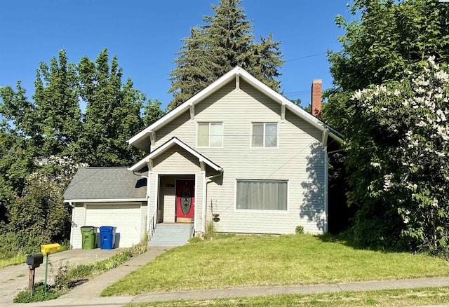 807 S Mill St, Colfax, WA 99111 - view of front facade featuring a front lawn, a garage, and a chimney
