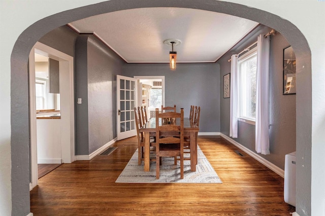 807 S Mill St, Colfax, WA 99111 - dining room with baseboards, wood finished floors, ornamental molding, and a textured wall