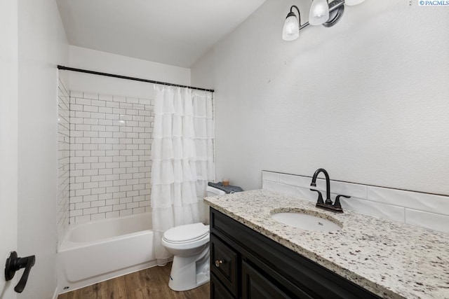 2913 W John Day Ave Unit D102, Kennewick, WA 99336 - full bathroom featuring wood finished floors, vanity, toilet, and shower / bath combination with curtain