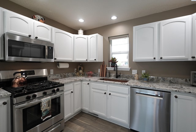 1135 SW Lost Trail Dr, Pullman, WA 99163 - kitchen with appliances with stainless steel finishes, white cabinets, and recessed lighting