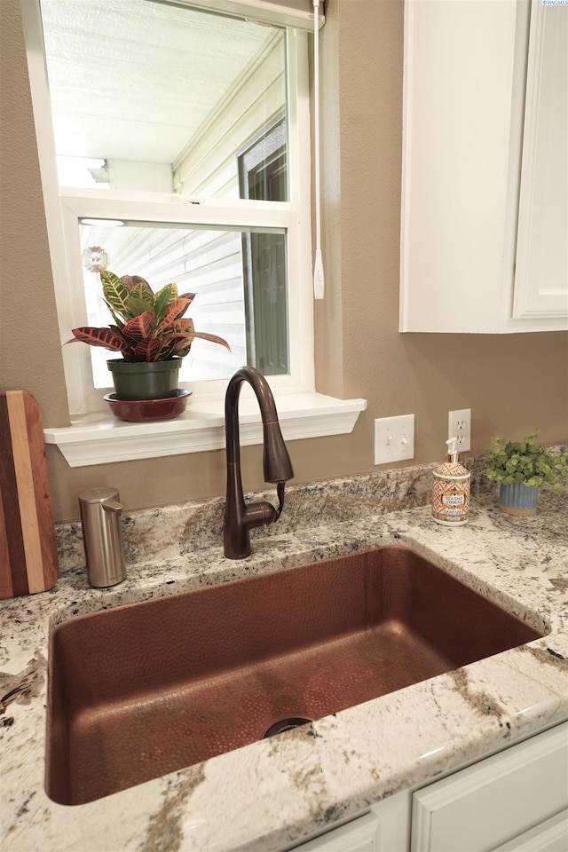 1135 SW Lost Trail Dr, Pullman, WA 99163 - kitchen view of white cabinets and light stone counters
