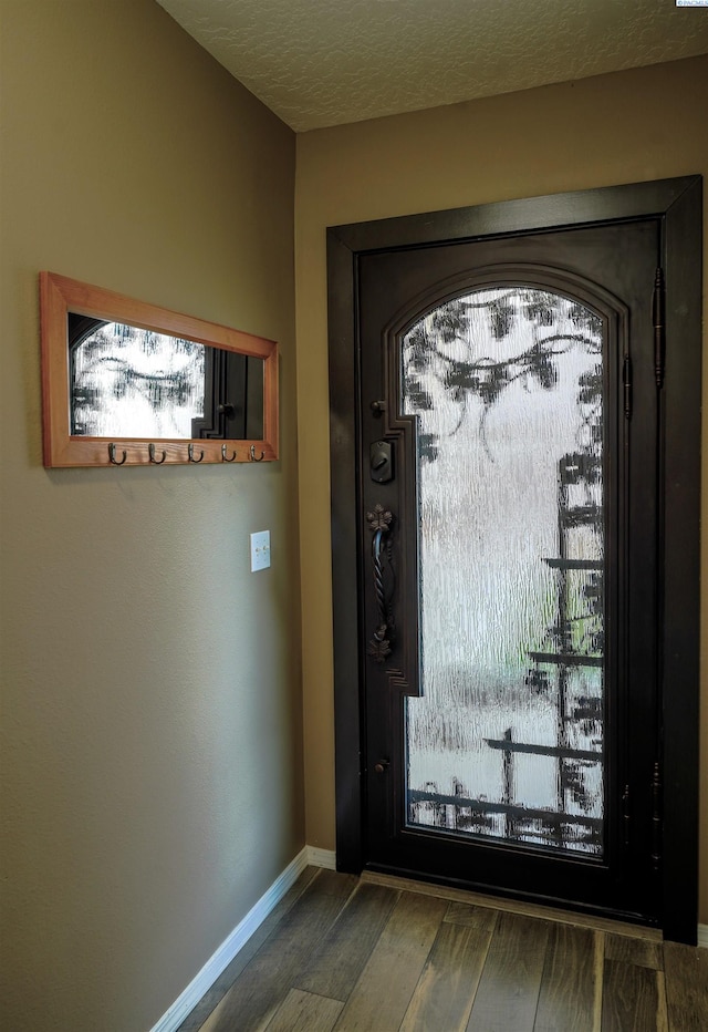 1135 SW Lost Trail Dr, Pullman, WA 99163 - doorway to outside featuring wood finished floors and baseboards