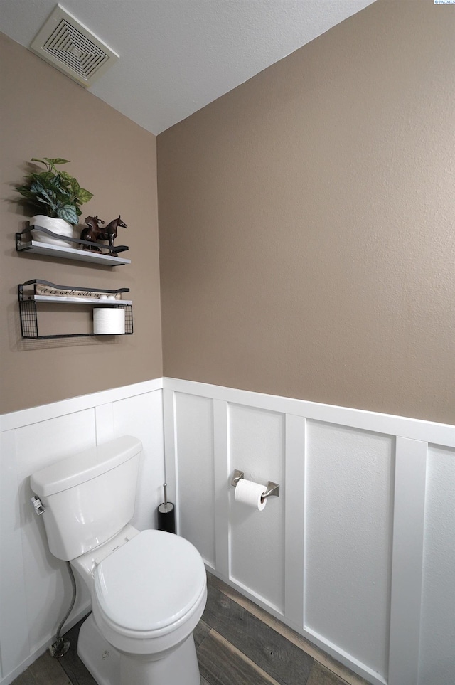 1135 SW Lost Trail Dr, Pullman, WA 99163 - bathroom with a wainscoted wall and wood finished floors