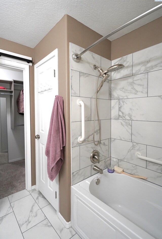 1135 SW Lost Trail Dr, Pullman, WA 99163 - bathroom featuring shower / bath combination, a textured ceiling, and marble look tile flooring