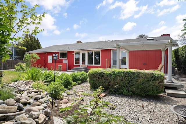 2714 W John Day Ave, Kennewick, WA 99336 - view of front of house with fence, a chimney, and entry steps