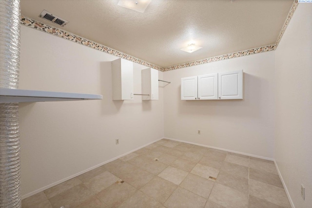 2714 W John Day Ave, Kennewick, WA 99336 - spare room with a textured ceiling and baseboards
