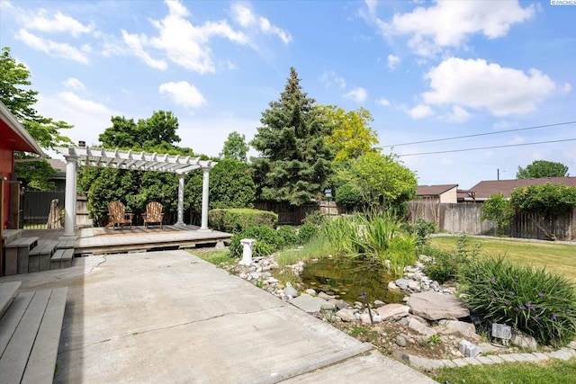 2714 W John Day Ave, Kennewick, WA 99336 - fenced backyard with a wooden deck and a pergola