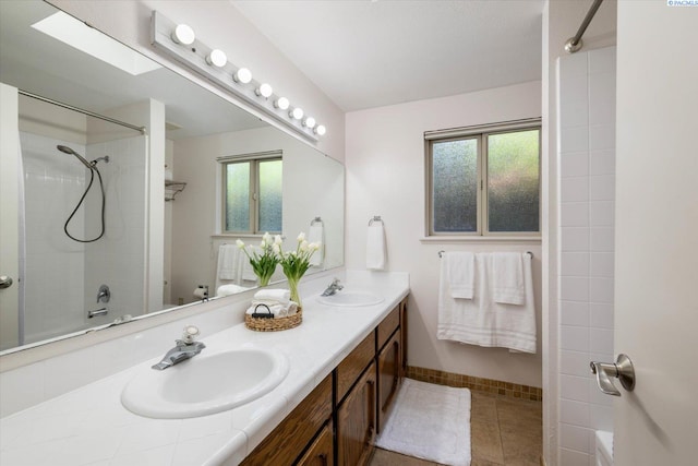 2714 W John Day Ave, Kennewick, WA 99336 - full bath featuring healthy amount of natural light, tile patterned floors, double vanity, and baseboards