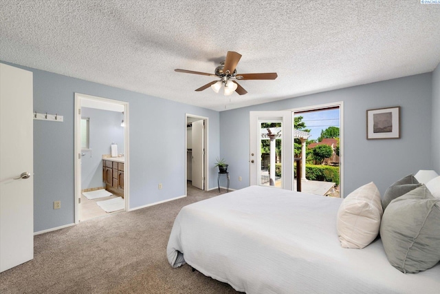 2714 W John Day Ave, Kennewick, WA 99336 - carpeted bedroom with access to outside, ensuite bathroom, a spacious closet, ceiling fan, and baseboards