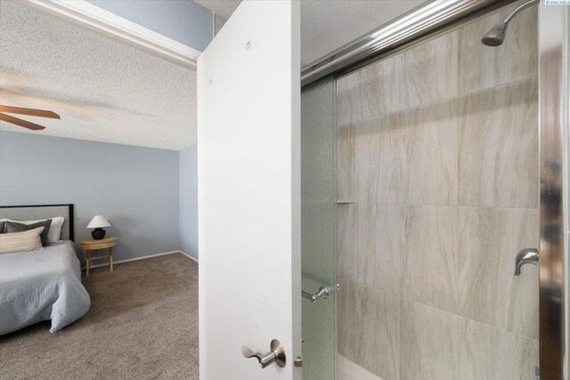 2714 W John Day Ave, Kennewick, WA 99336 - full bathroom with a tile shower, ceiling fan, and a textured ceiling