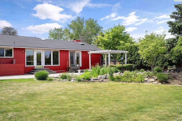 2714 W John Day Ave, Kennewick, WA 99336 - back of house featuring entry steps, a pergola, a lawn, a chimney, and roof with shingles
