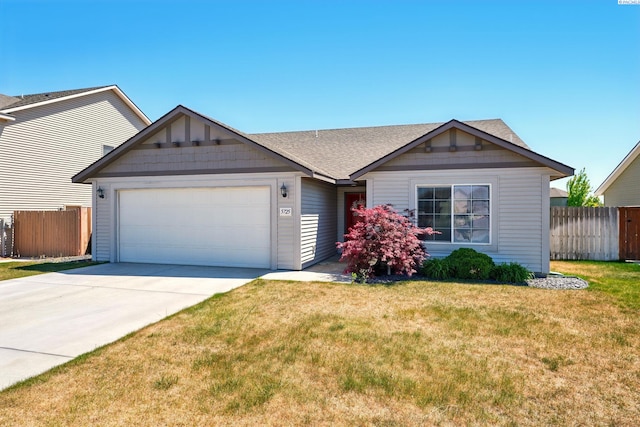 5725 Sidon Ln, Pasco, WA 99301 - ranch-style home featuring a garage, driveway, and a shingled roof