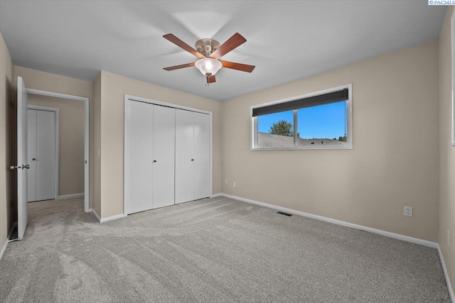 707 N Quillan St, Kennewick, WA 99336 - unfurnished bedroom featuring carpet, a closet, and a ceiling fan