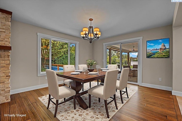 707 N Quillan St, Kennewick, WA 99336 - dining space featuring a chandelier and light wood-type flooring