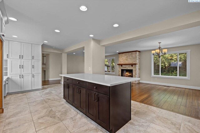 707 N Quillan St, Kennewick, WA 99336 - kitchen featuring white cabinetry, light countertops, recessed lighting, healthy amount of natural light, and a chandelier