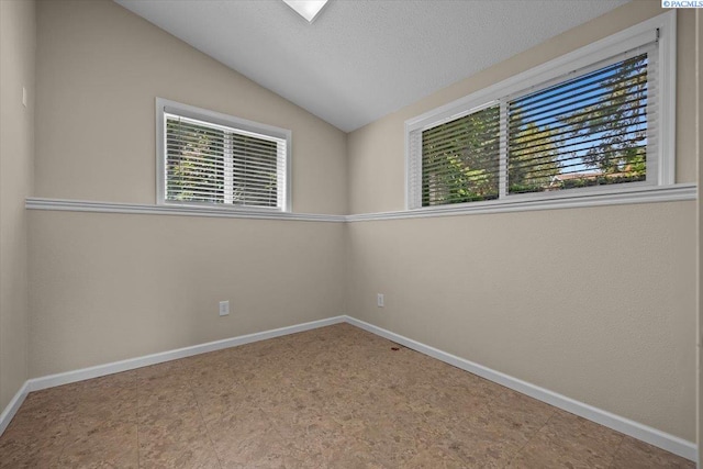 707 N Quillan St, Kennewick, WA 99336 - empty room featuring plenty of natural light and vaulted ceiling