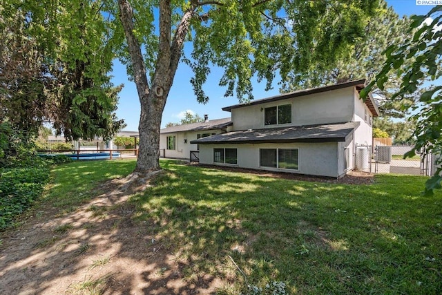 707 N Quillan St, Kennewick, WA 99336 - rear view of house with stucco siding