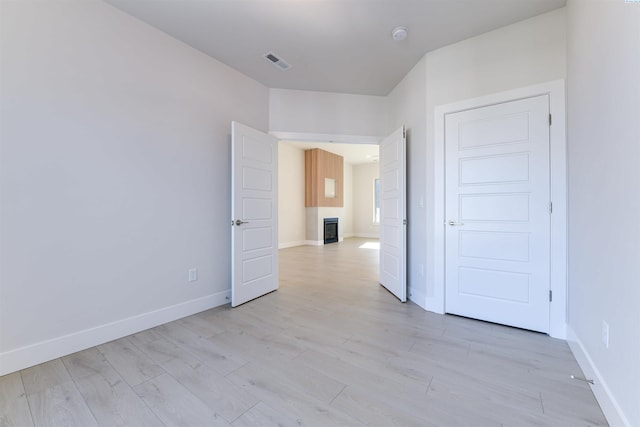 unfurnished room with light hardwood / wood-style floors