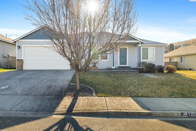 ranch-style house with a garage, concrete driveway, and a front yard